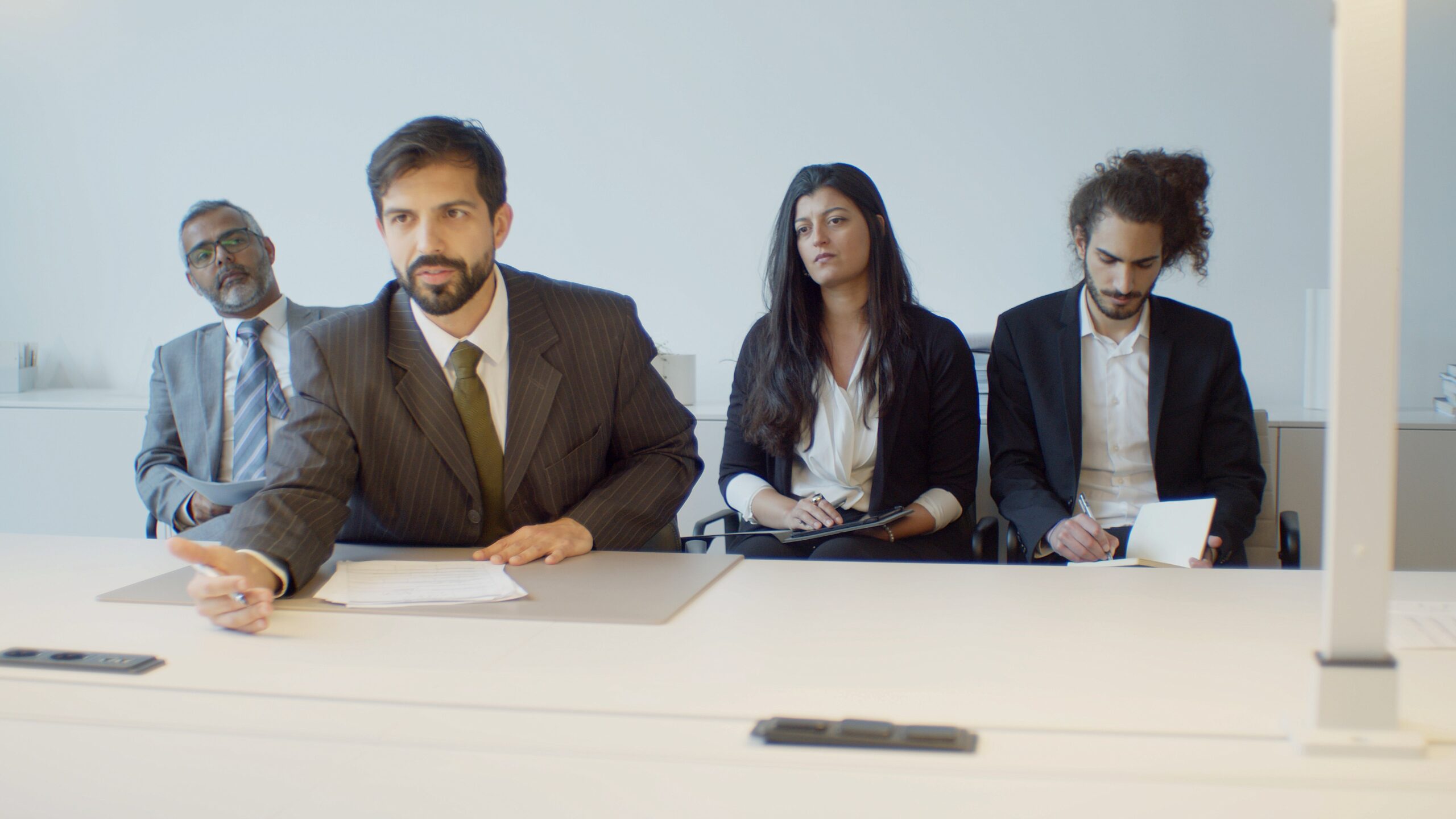 four recruiters in a modern office setting