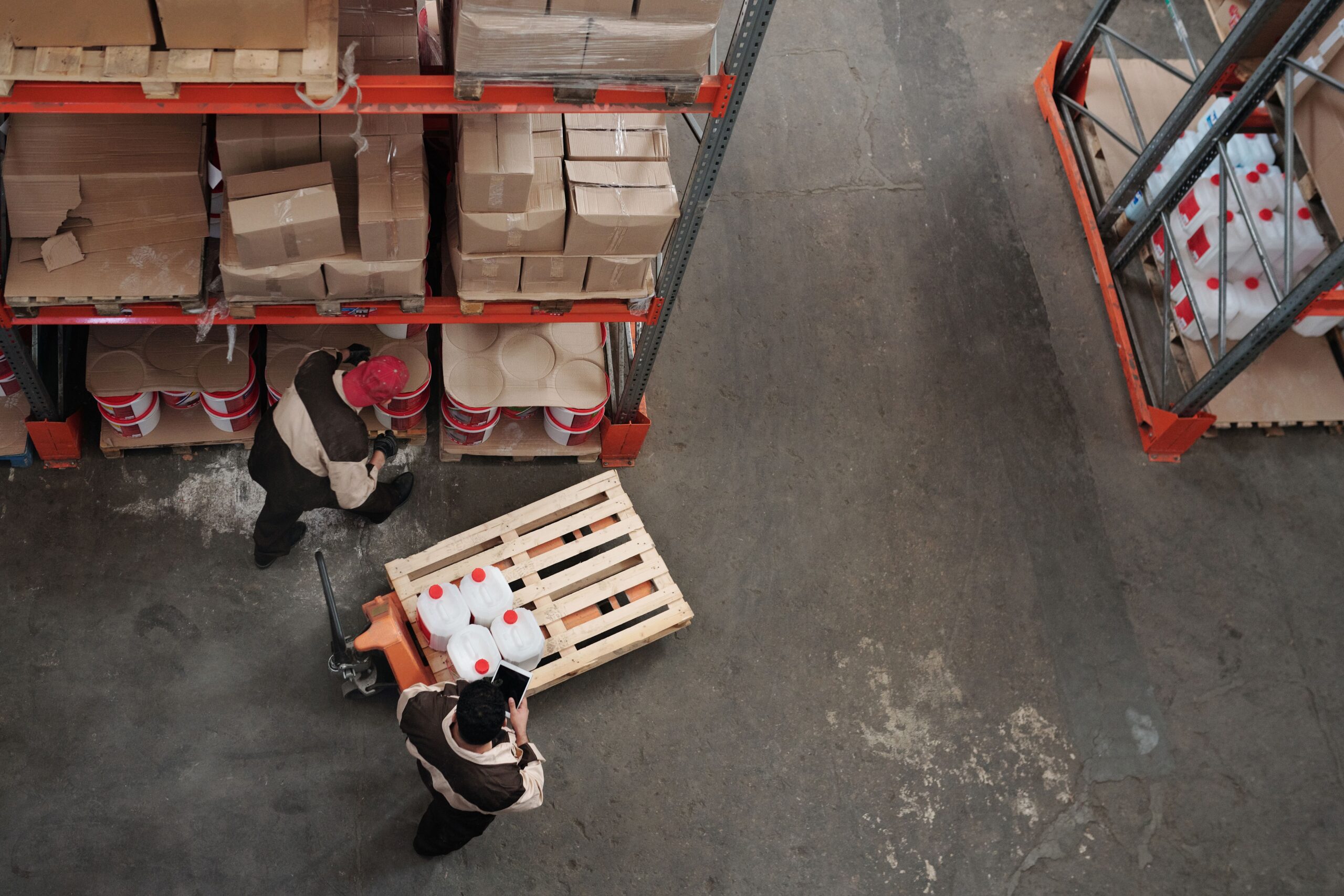 High angle view of workers organizing inventory in a warehouse