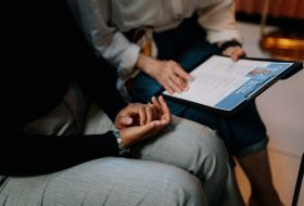 Two people checking the Resume