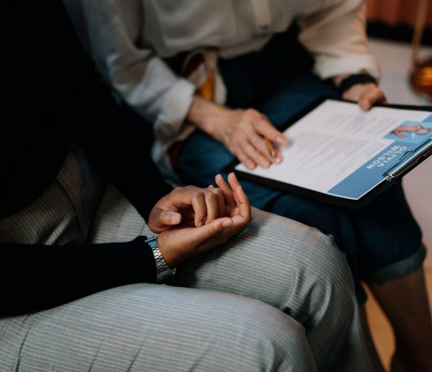 Two people checking the Resume