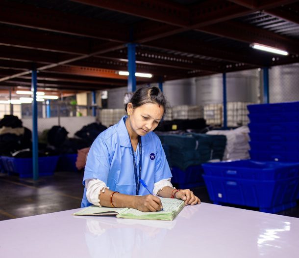 a warehouse worker calculating