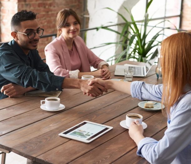 Company people and Candidate shaking hands