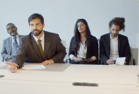 four recruiters in a modern office setting