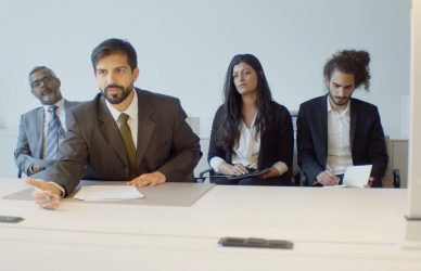 four recruiters in a modern office setting